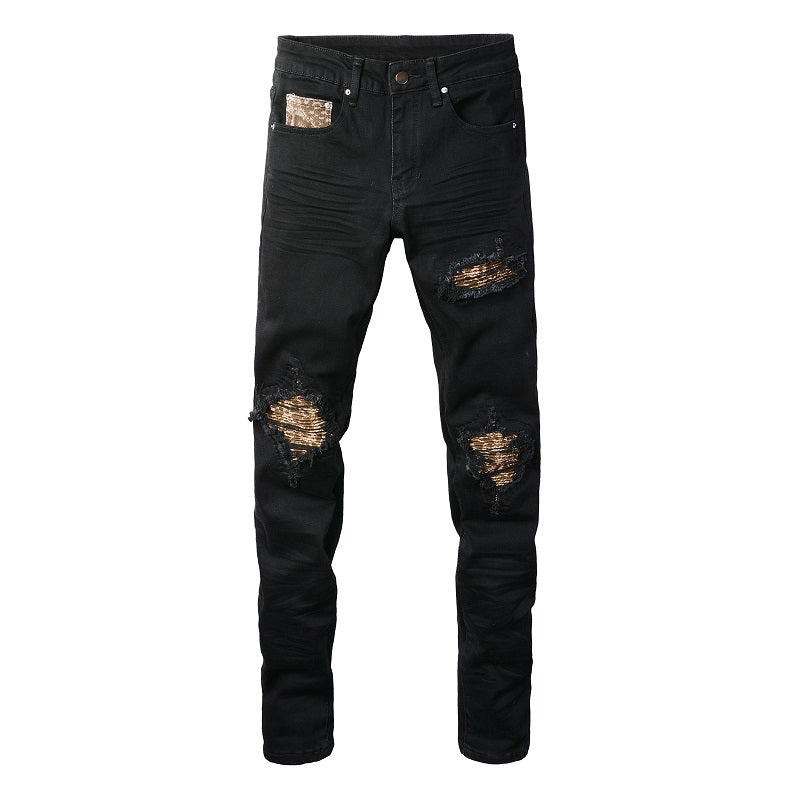 Schwarze Distressed Jeans mit goldenen Patch-Details