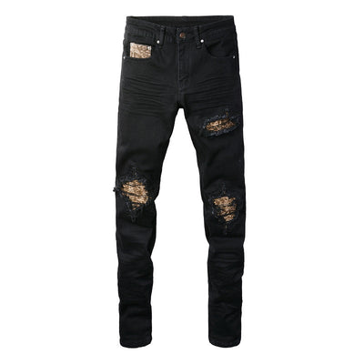 Schwarze Distressed Jeans mit goldenen Patch-Details
