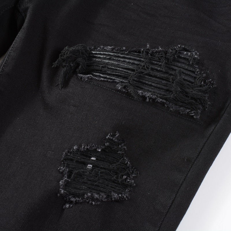 Jean à empiècements en cuir noir