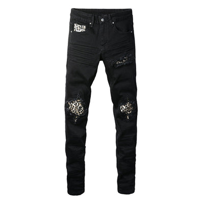 Schwarze Distressed Jeans mit Leoparden Patch Details