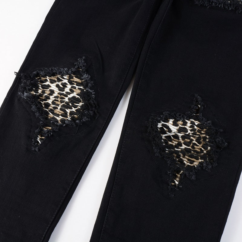 Schwarze Distressed Jeans mit Leoparden Patch Details
