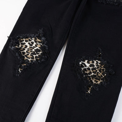 Schwarze Distressed Jeans mit Leoparden Patch Details