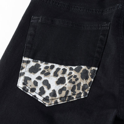Schwarze Distressed Jeans mit Leoparden Patch Details